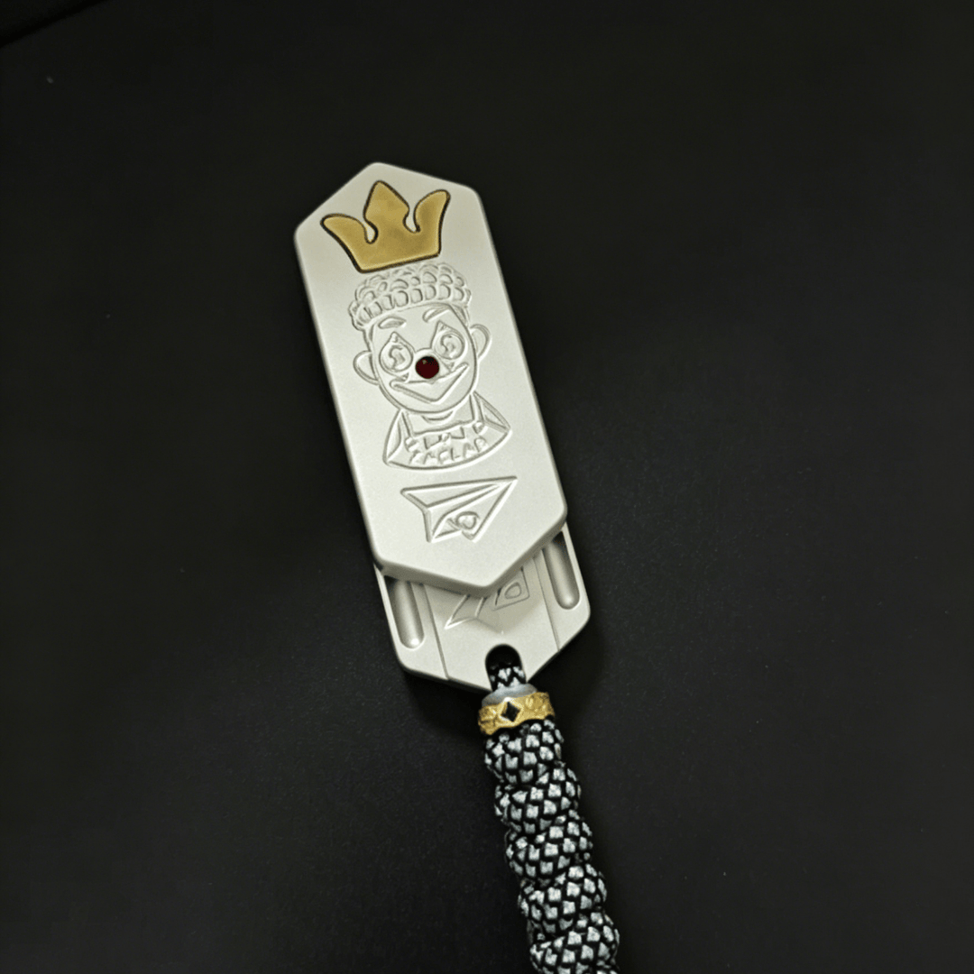 Lucky Candy Tuning Fork EDC Push Slider with a clown design and crown detail, ideal for collectors.