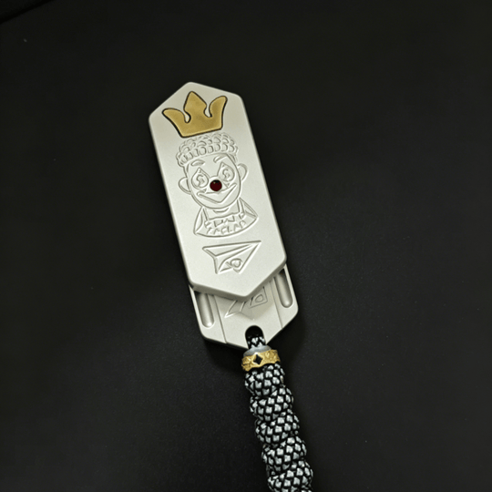 Lucky Candy Tuning Fork EDC Push Slider with a clown design and crown detail, ideal for collectors.